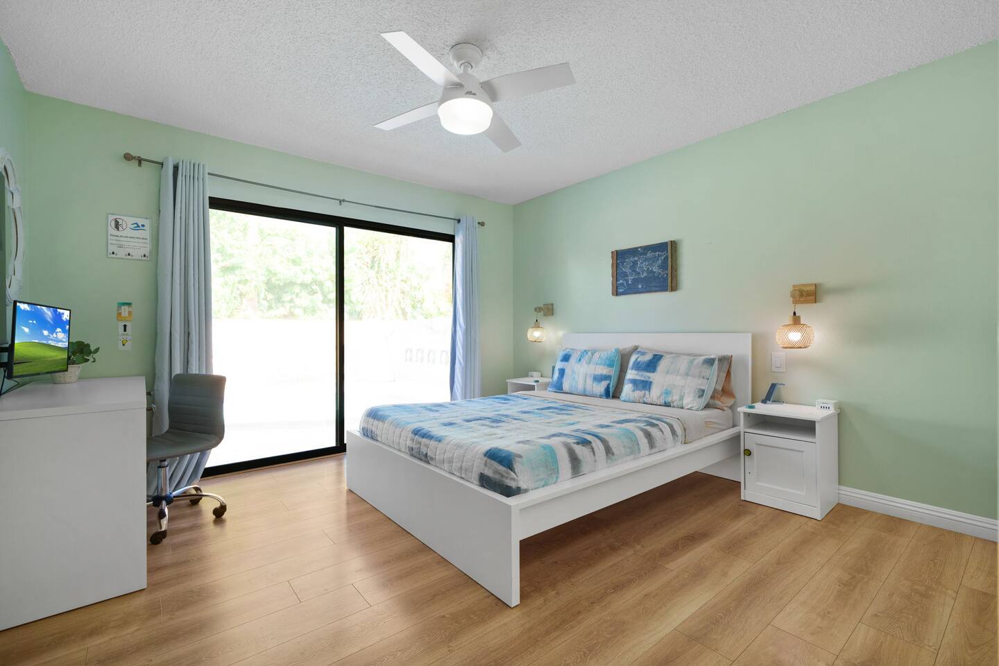 A king bed with a private workstation