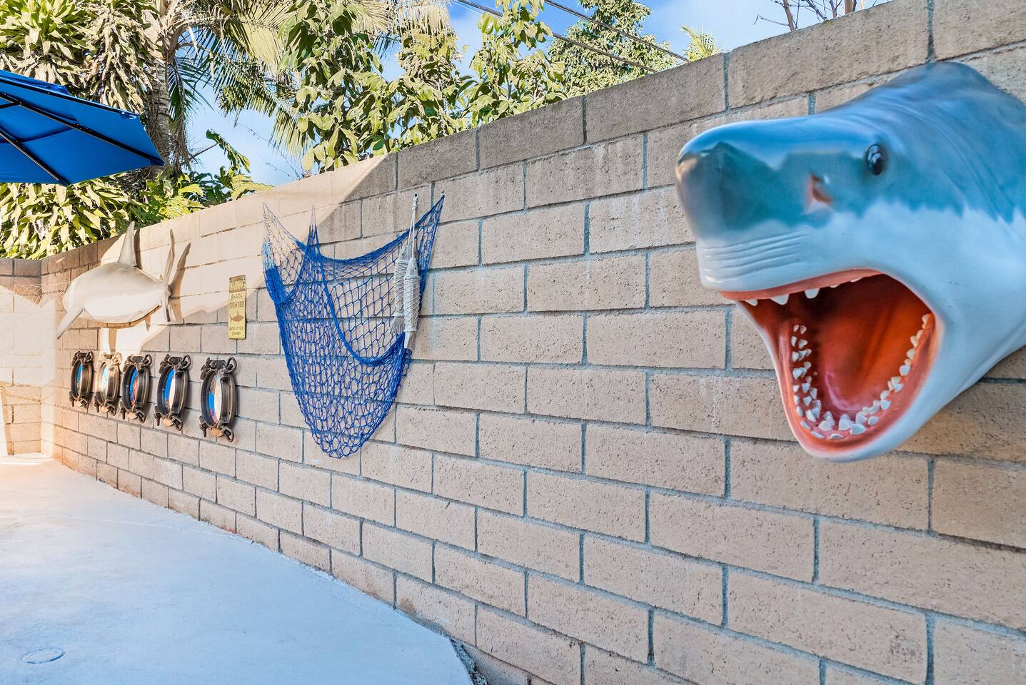 Shark decor around the pool.