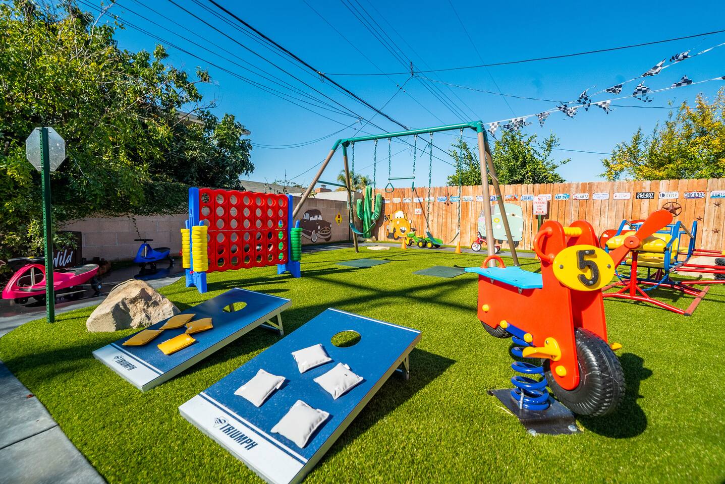 Corn hole, Connect 4, spring riders, and swing set!
