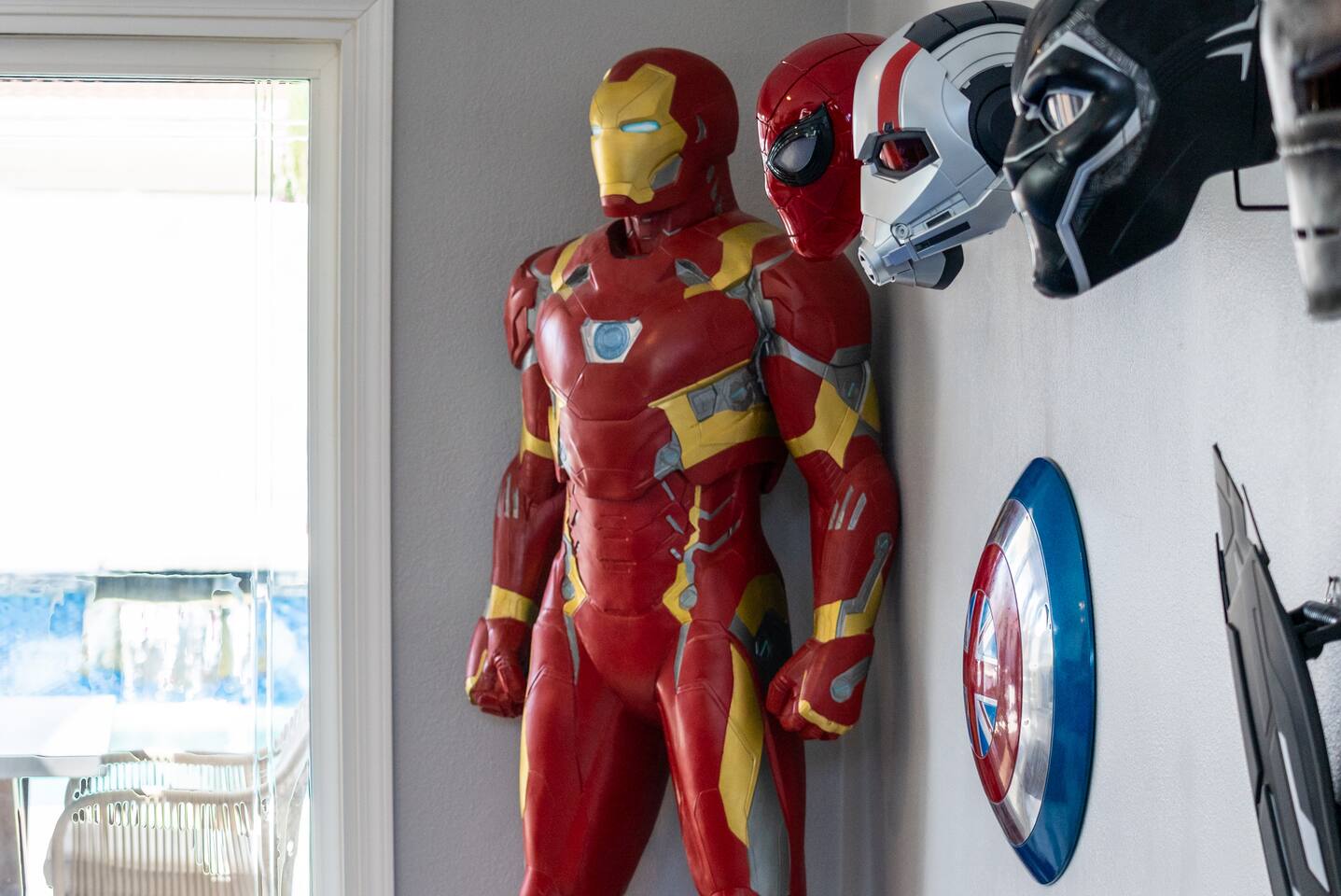 Iron Man statue and Captain America shield. 