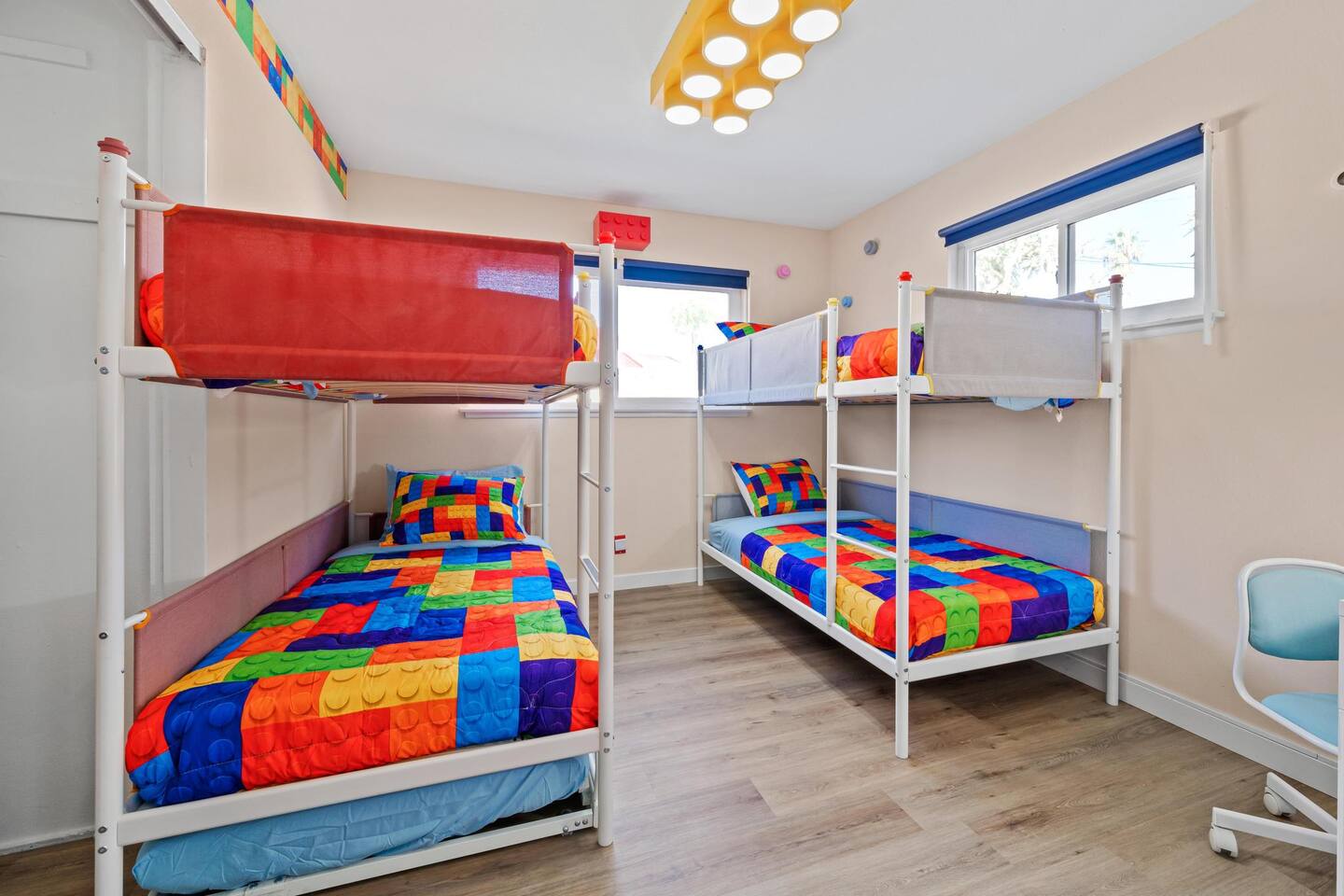 Two sets of bunk beds in the kid's bedroom.