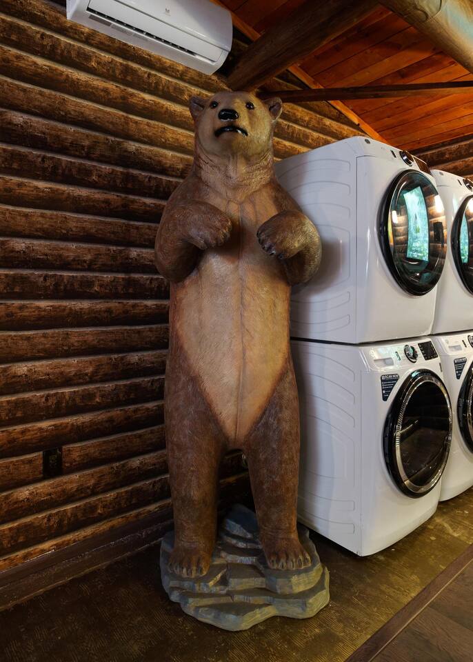 Bear statue in movie theatre room.