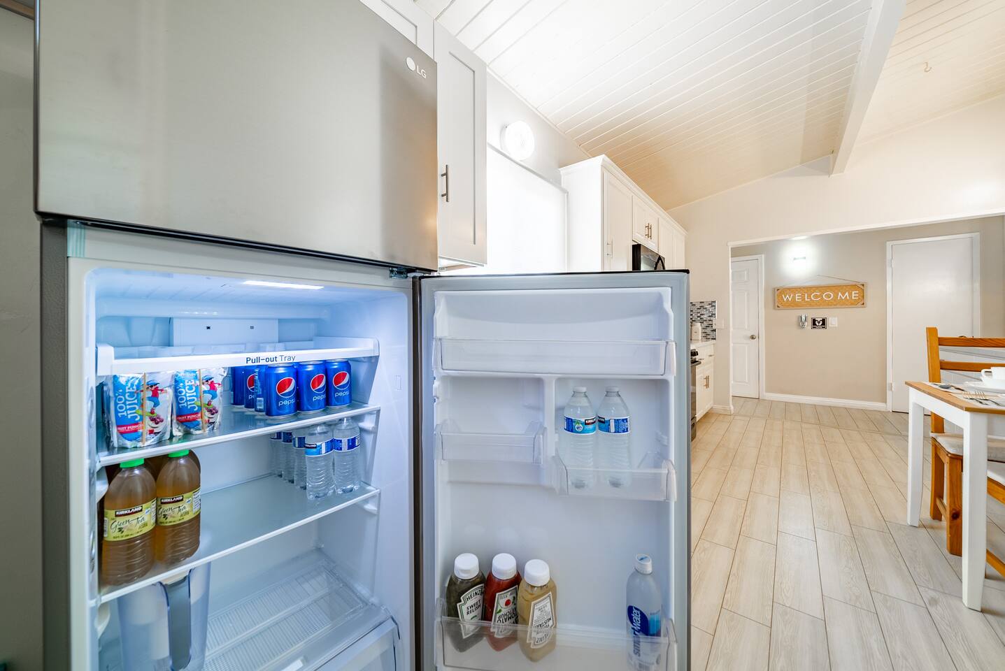 Fridge is stocked with soda and juice!
