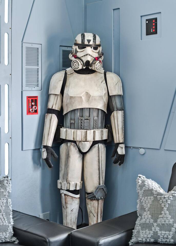 A stormtrooper serves as security, one of the many statues spread throughout the house.