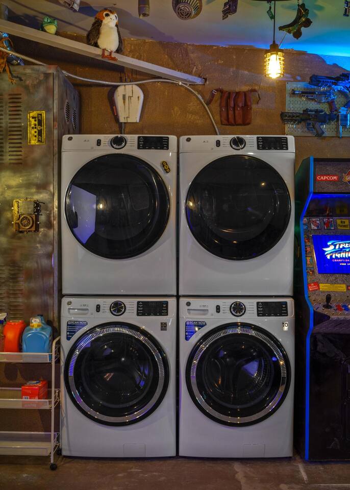 Two sets of washers and dryers in the droid depot.